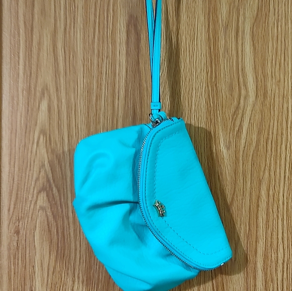 Juicy Couture Handbags - Juicy Couture Teal Wristlet with ink transfer mark USED